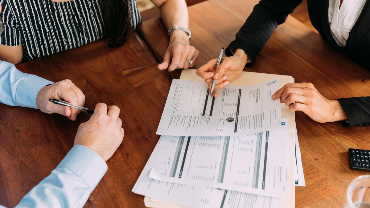 Advisors reviewing financial documents together